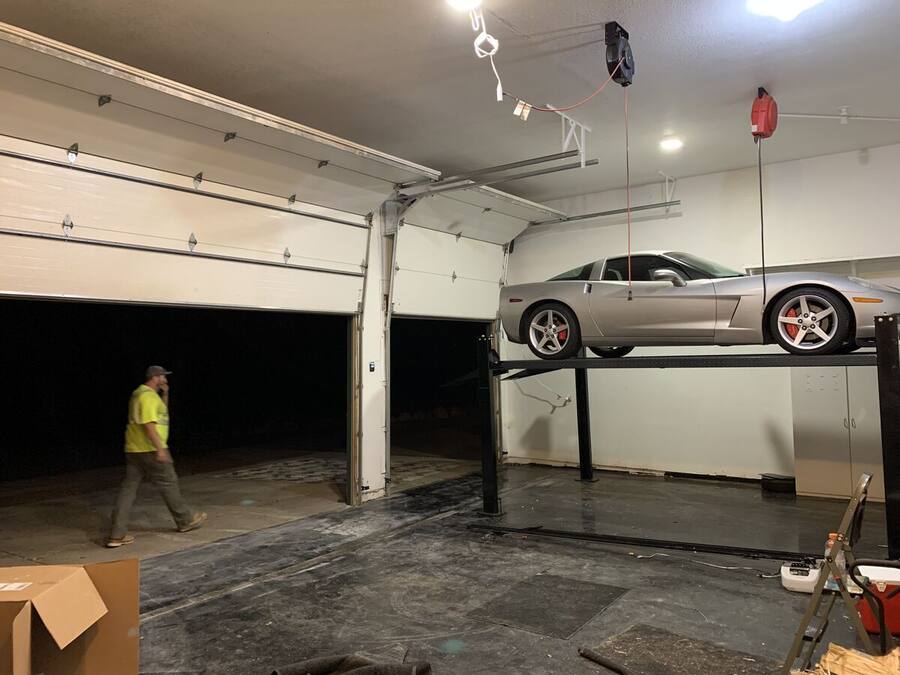 Overhead doors in a garage with a car lift